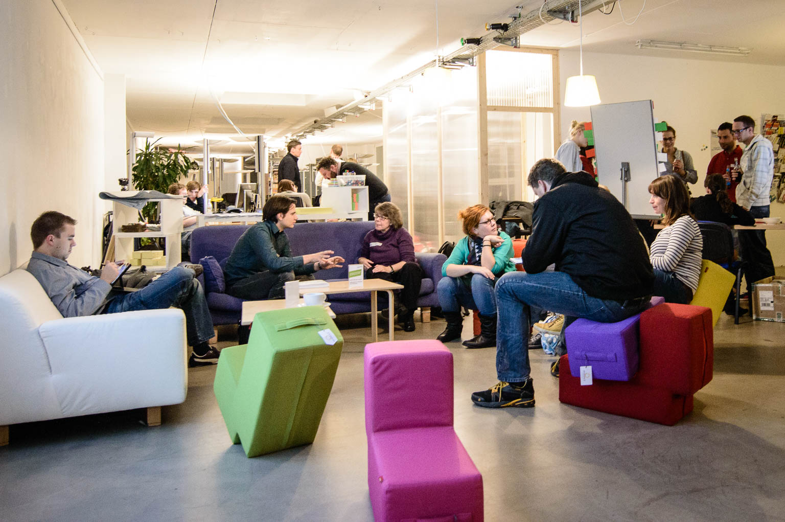 Coworking Nuremberg event lounge with comfortable sofas and seating